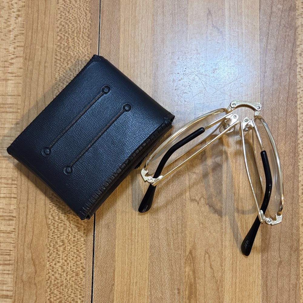 Reading Folding glasses +2.25 gold-rimmed frame w/small bag.